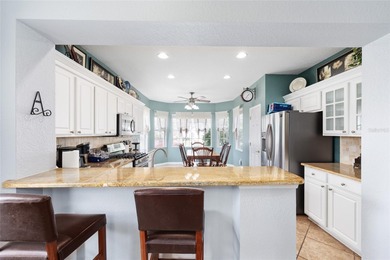 This beautifully maintained original-owner home features a 27' on Eagle Ridge At Spruce Creek Country Club in Florida - for sale on GolfHomes.com, golf home, golf lot