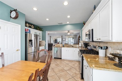 This beautifully maintained original-owner home features a 27' on Eagle Ridge At Spruce Creek Country Club in Florida - for sale on GolfHomes.com, golf home, golf lot