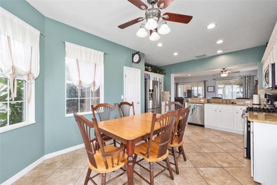 This beautifully maintained original-owner home features a 27' on Eagle Ridge At Spruce Creek Country Club in Florida - for sale on GolfHomes.com, golf home, golf lot