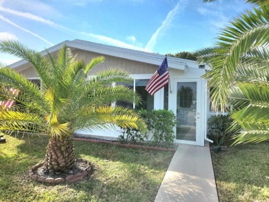 Nestled in the serene Cypress Lakes, a vibrant 55+ community on Cypress Lakes Golf Course - West Palm Beach in Florida - for sale on GolfHomes.com, golf home, golf lot
