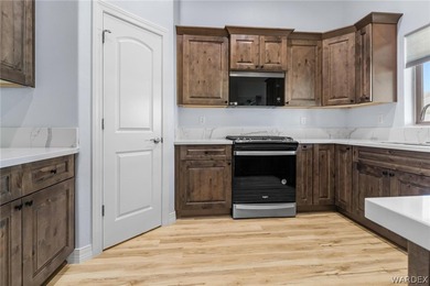 CUSTOM AND LIKE BRAND NEW! BUILT IN 2023, THIS 3 BEDROOM, 2 BATH on Desert Lakes Golf Course in Arizona - for sale on GolfHomes.com, golf home, golf lot