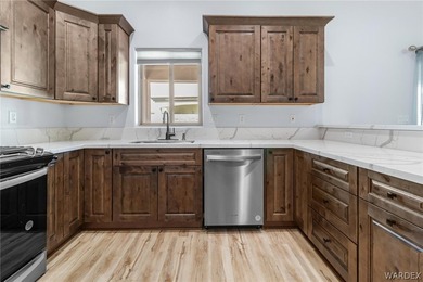 CUSTOM AND LIKE BRAND NEW! BUILT IN 2023, THIS 3 BEDROOM, 2 BATH on Desert Lakes Golf Course in Arizona - for sale on GolfHomes.com, golf home, golf lot