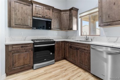 CUSTOM AND LIKE BRAND NEW! BUILT IN 2023, THIS 3 BEDROOM, 2 BATH on Desert Lakes Golf Course in Arizona - for sale on GolfHomes.com, golf home, golf lot