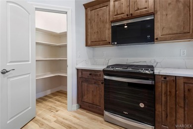 CUSTOM AND LIKE BRAND NEW! BUILT IN 2023, THIS 3 BEDROOM, 2 BATH on Desert Lakes Golf Course in Arizona - for sale on GolfHomes.com, golf home, golf lot