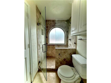 This spacious 2 bedroom, 2 bath condo with an open-concept on Royal Oaks Country Club in Texas - for sale on GolfHomes.com, golf home, golf lot