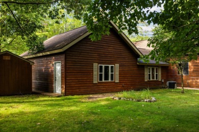 Welcome to this 3-bedroom, 2-bath home in the desirable Michaywe on Michaywe Pines Course in Michigan - for sale on GolfHomes.com, golf home, golf lot