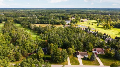 Welcome to this 3-bedroom, 2-bath home in the desirable Michaywe on Michaywe Pines Course in Michigan - for sale on GolfHomes.com, golf home, golf lot