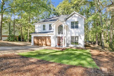 This stunning 3-bedroom, 2-bath home, located in the heart of on Lake Forest Yacht and Country Club in Alabama - for sale on GolfHomes.com, golf home, golf lot