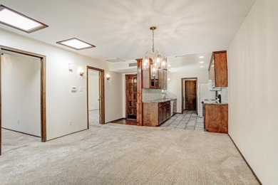 This lovely townhome in sought after Chimney Ridge sits directly on Arroyo Del Oso Golf Course in New Mexico - for sale on GolfHomes.com, golf home, golf lot