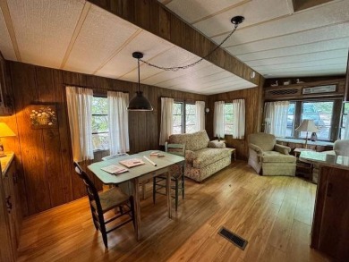 Linville Land Harbor- Relax on the covered deck and  enjoy the on Land Harbor Golf Course in North Carolina - for sale on GolfHomes.com, golf home, golf lot