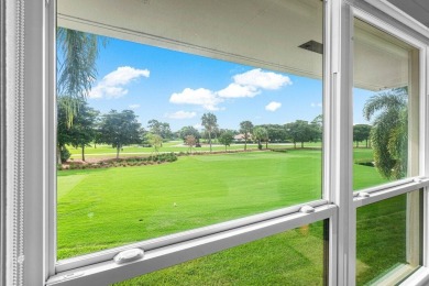 Captivating golf course & lake views grace your windows and on Quail Ridge Golf Course and Country Club in Florida - for sale on GolfHomes.com, golf home, golf lot