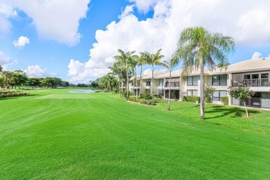 Captivating golf course & lake views grace your windows and on Quail Ridge Golf Course and Country Club in Florida - for sale on GolfHomes.com, golf home, golf lot