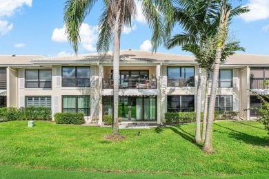 Captivating golf course & lake views grace your windows and on Quail Ridge Golf Course and Country Club in Florida - for sale on GolfHomes.com, golf home, golf lot