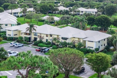 Captivating golf course & lake views grace your windows and on Quail Ridge Golf Course and Country Club in Florida - for sale on GolfHomes.com, golf home, golf lot