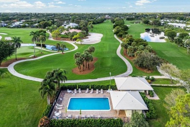 Captivating golf course & lake views grace your windows and on Quail Ridge Golf Course and Country Club in Florida - for sale on GolfHomes.com, golf home, golf lot