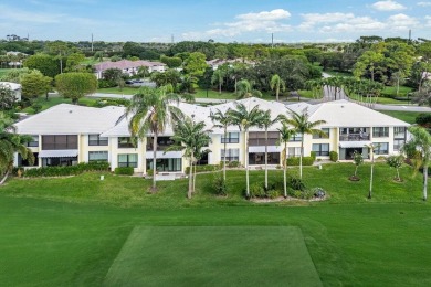 Captivating golf course & lake views grace your windows and on Quail Ridge Golf Course and Country Club in Florida - for sale on GolfHomes.com, golf home, golf lot