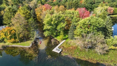 One of a kind Chain O'Lakes Home on a peninsula surrounded by on Foxfire Golf Club in Wisconsin - for sale on GolfHomes.com, golf home, golf lot
