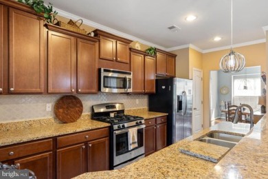 Welcome to this stunning 4-bedroom, 2.5-bathroom end unit on Plantation Lakes Golf and Country Club in Delaware - for sale on GolfHomes.com, golf home, golf lot
