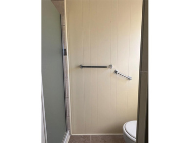 This charming double-wide home is ideally situated at the end of on Fairway Village Golf Course in Florida - for sale on GolfHomes.com, golf home, golf lot