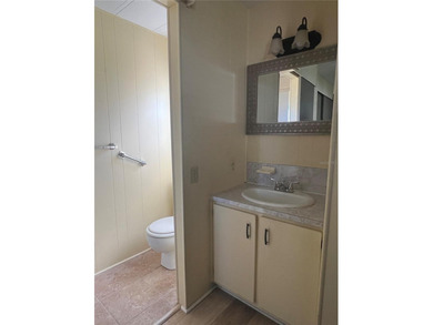 This charming double-wide home is ideally situated at the end of on Fairway Village Golf Course in Florida - for sale on GolfHomes.com, golf home, golf lot