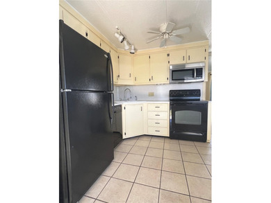 This charming double-wide home is ideally situated at the end of on Fairway Village Golf Course in Florida - for sale on GolfHomes.com, golf home, golf lot