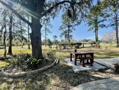 Enjoy your views of the Magnolia Point Golf course from this on Magnolia Point Golf and Country Club in Florida - for sale on GolfHomes.com, golf home, golf lot