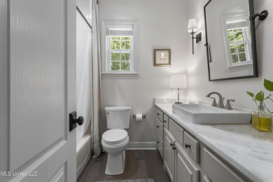 This beautifully appointed 3-bedroom, 2.5-bath home is the on Diamondhead Country Club in Mississippi - for sale on GolfHomes.com, golf home, golf lot