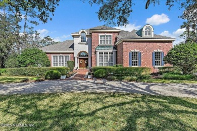 This classic beauty stands proudly on over  1/2  an acre in the on Marsh Landing Country Club - Saint Johns County in Florida - for sale on GolfHomes.com, golf home, golf lot