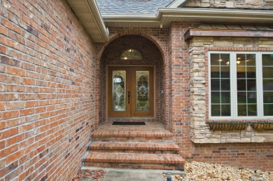 Welcome to the inviting haven of 1411 Stoney Creek Circle on Ledgestone Country Club and Golf Course in Missouri - for sale on GolfHomes.com, golf home, golf lot