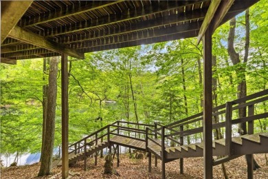 Charming Lakefront Cabin tucked away in the woods overlooking on Hide-A-Way Hills Golf Club in Ohio - for sale on GolfHomes.com, golf home, golf lot