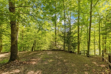 Charming Lakefront Cabin tucked away in the woods overlooking on Hide-A-Way Hills Golf Club in Ohio - for sale on GolfHomes.com, golf home, golf lot