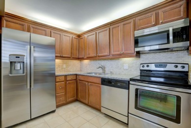 Step into unparalleled views with this stunning 7th floor on Jupiter Dunes Golf Course in Florida - for sale on GolfHomes.com, golf home, golf lot
