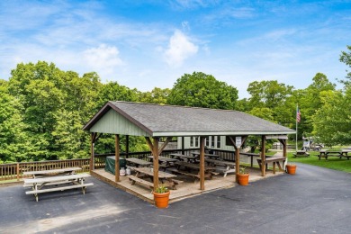 Charming Lakefront Cabin tucked away in the woods overlooking on Hide-A-Way Hills Golf Club in Ohio - for sale on GolfHomes.com, golf home, golf lot