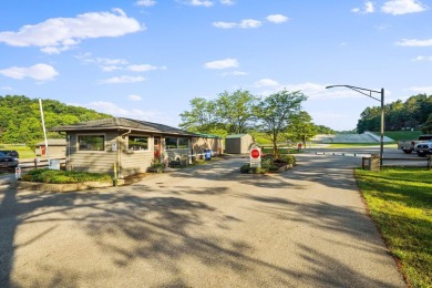 Charming Lakefront Cabin tucked away in the woods overlooking on Hide-A-Way Hills Golf Club in Ohio - for sale on GolfHomes.com, golf home, golf lot