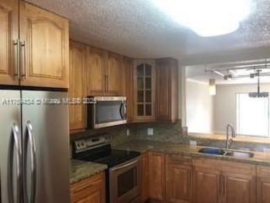 Welcome to this beautifully updated 2-bedroom, 2-bath condo on Flamingo Lakes Country Club in Florida - for sale on GolfHomes.com, golf home, golf lot