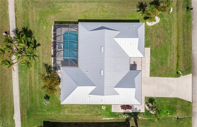 Wake up to sweeping golf course and water views in this on Royal Tee Country Club in Florida - for sale on GolfHomes.com, golf home, golf lot