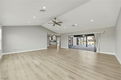 Wake up to sweeping golf course and water views in this on Royal Tee Country Club in Florida - for sale on GolfHomes.com, golf home, golf lot