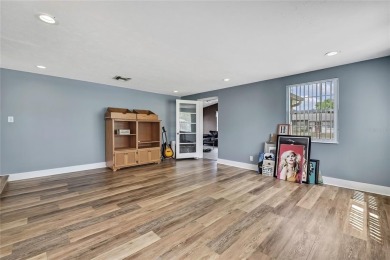 Located in FOREST HILLS, this charming Mid-Century home sits on on Babe Zaharias Golf Course in Florida - for sale on GolfHomes.com, golf home, golf lot