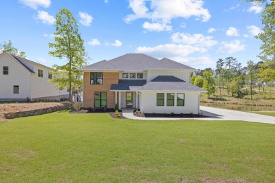THIS GORGEOUS NEW CONSTRUCTION IS DIRECTLY ON OSPREY POINTE POND on Harbor Club Golf and Country Club in Georgia - for sale on GolfHomes.com, golf home, golf lot