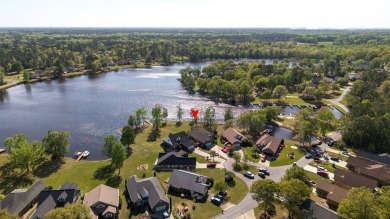 Spectacular waterfront home on Lake Arbu w/ panoramic water on Players Course At Wyboo Plantation in South Carolina - for sale on GolfHomes.com, golf home, golf lot