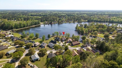 Spectacular waterfront home on Lake Arbu w/ panoramic water on Players Course At Wyboo Plantation in South Carolina - for sale on GolfHomes.com, golf home, golf lot