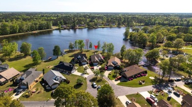 Spectacular waterfront home on Lake Arbu w/ panoramic water on Players Course At Wyboo Plantation in South Carolina - for sale on GolfHomes.com, golf home, golf lot