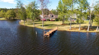 Spectacular waterfront home on Lake Arbu w/ panoramic water on Players Course At Wyboo Plantation in South Carolina - for sale on GolfHomes.com, golf home, golf lot
