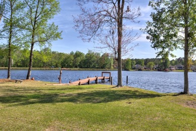 Spectacular waterfront home on Lake Arbu w/ panoramic water on Players Course At Wyboo Plantation in South Carolina - for sale on GolfHomes.com, golf home, golf lot