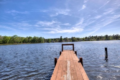 Spectacular waterfront home on Lake Arbu w/ panoramic water on Players Course At Wyboo Plantation in South Carolina - for sale on GolfHomes.com, golf home, golf lot