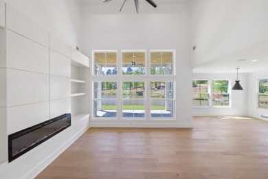 THIS GORGEOUS NEW CONSTRUCTION IS DIRECTLY ON OSPREY POINTE POND on Harbor Club Golf and Country Club in Georgia - for sale on GolfHomes.com, golf home, golf lot