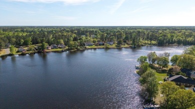 Spectacular waterfront home on Lake Arbu w/ panoramic water on Players Course At Wyboo Plantation in South Carolina - for sale on GolfHomes.com, golf home, golf lot