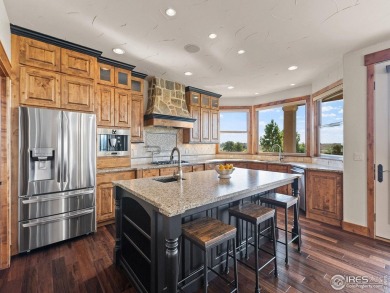 This custom home captures some of the finest views in Highland on Highland Meadows Golf Course in Colorado - for sale on GolfHomes.com, golf home, golf lot