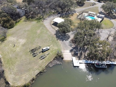 Gently sloping, wooded double lot totalling .67 acre in the on Apple Rock Golf Course - Horseshoe Bay in Texas - for sale on GolfHomes.com, golf home, golf lot