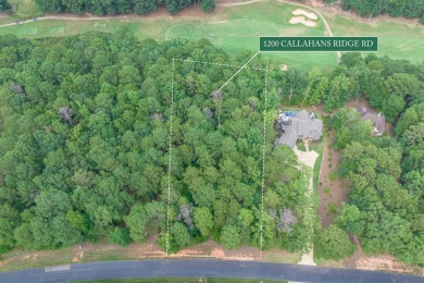 Located on the 6th fairway of the renowned National Golf Course on Reynolds Lake Oconee - The Oconee in Georgia - for sale on GolfHomes.com, golf home, golf lot